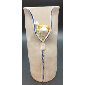 Charming Cream and Blue Ceramic Vase with Whimsical Design